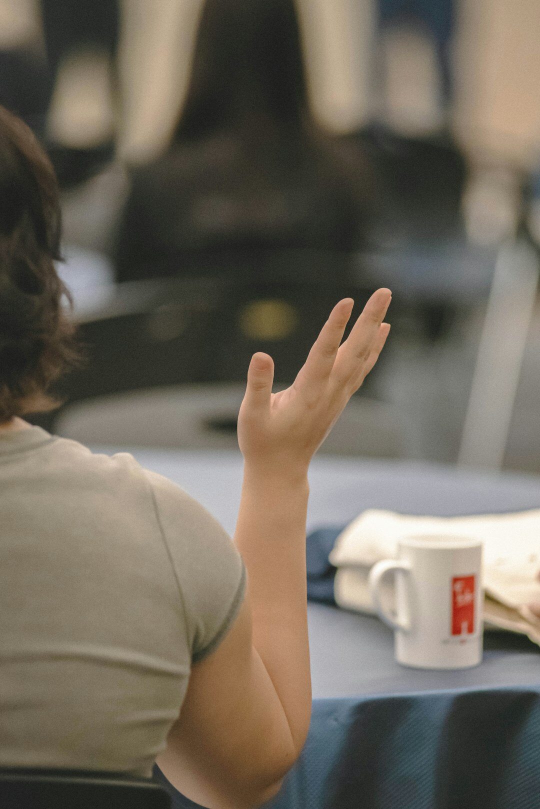 woman gesturing during conversation