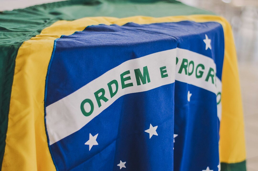 Group of Brazilian professionals discussing ideas around a table